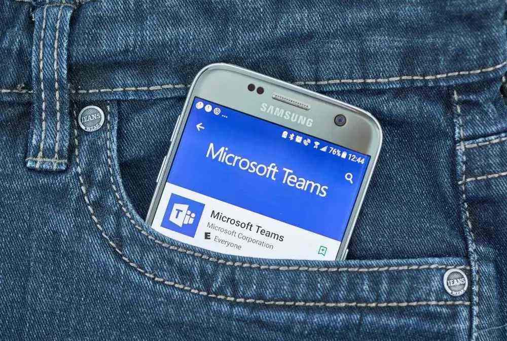 mobile phone in a side pocket with microsoft team app view