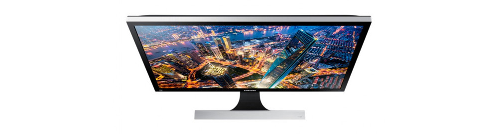 computer monitor with a cityscape in the background